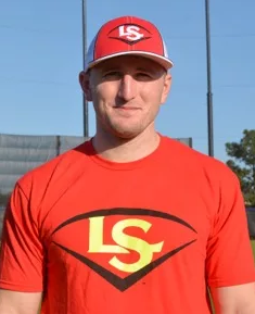 A baseball player wearing a red shirt and hat.