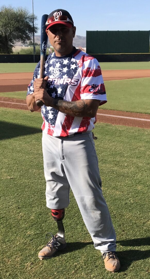 A Man With Prosthetic Leg, USA Flag Top and Baseball Bat