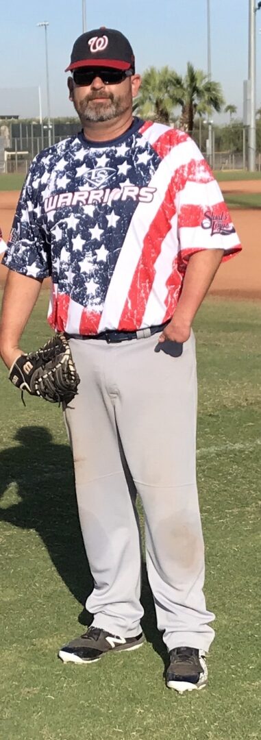 A baseball player in an american flag shirt.