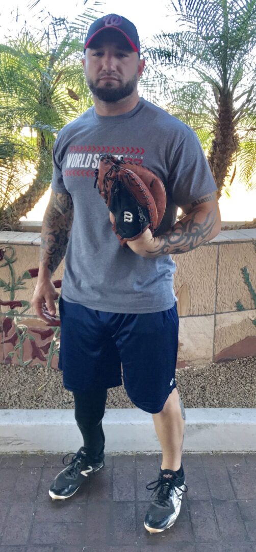 A man holding a baseball glove in his hand.