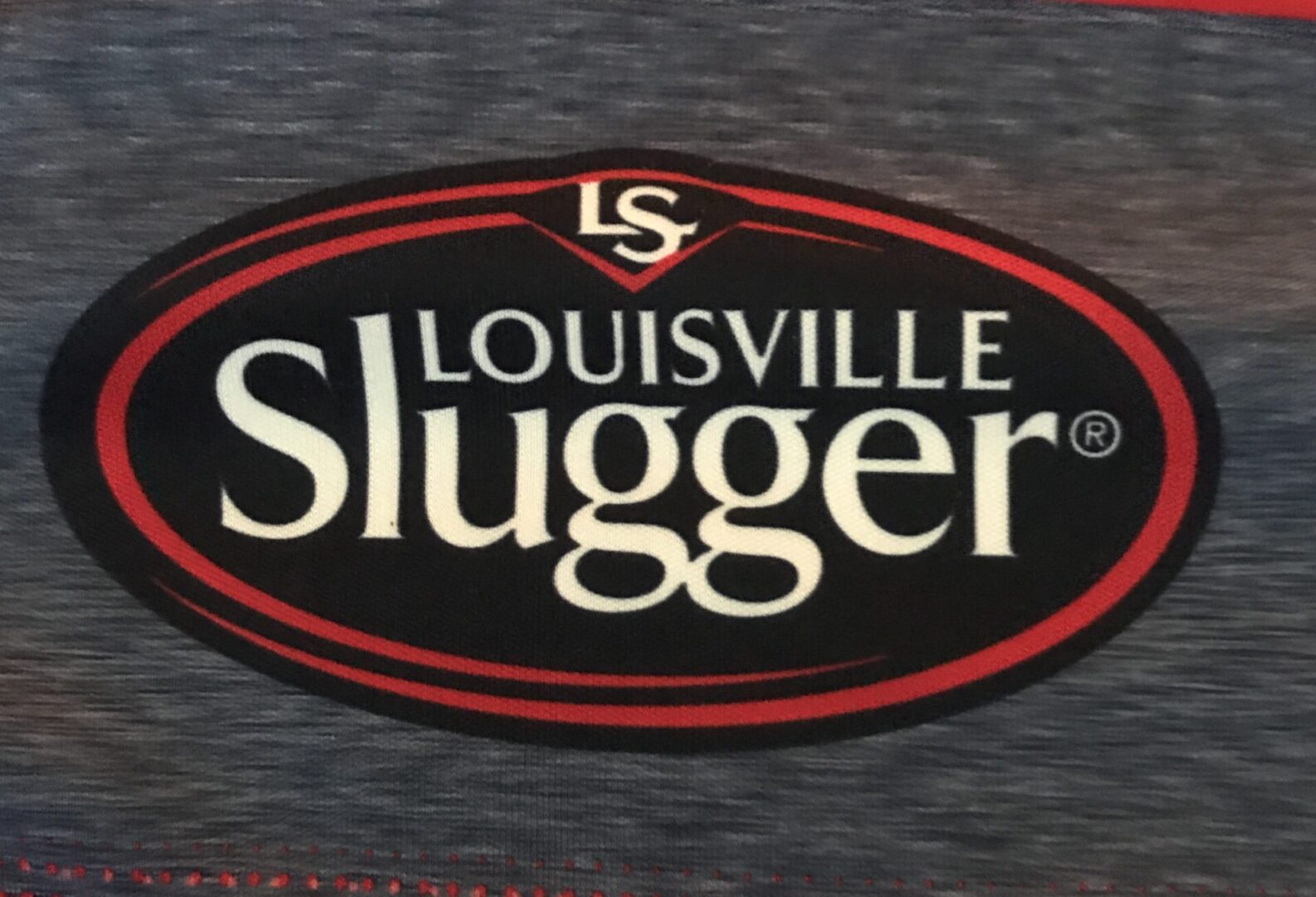 Louisville Slugger Logo in White, Black and Red on a Shirt