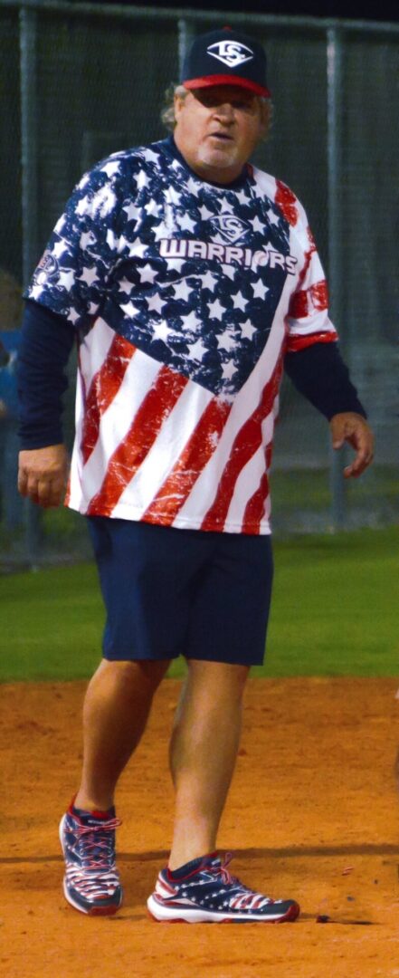 A man in american flag shirt and shorts.
