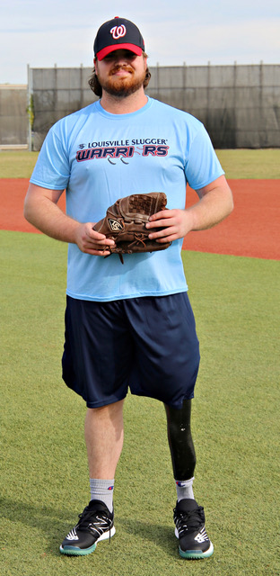 A man holding a catchers mitt on top of a field.