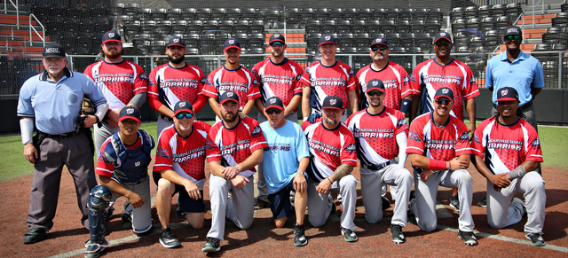 A group of baseball players posing for a picture.