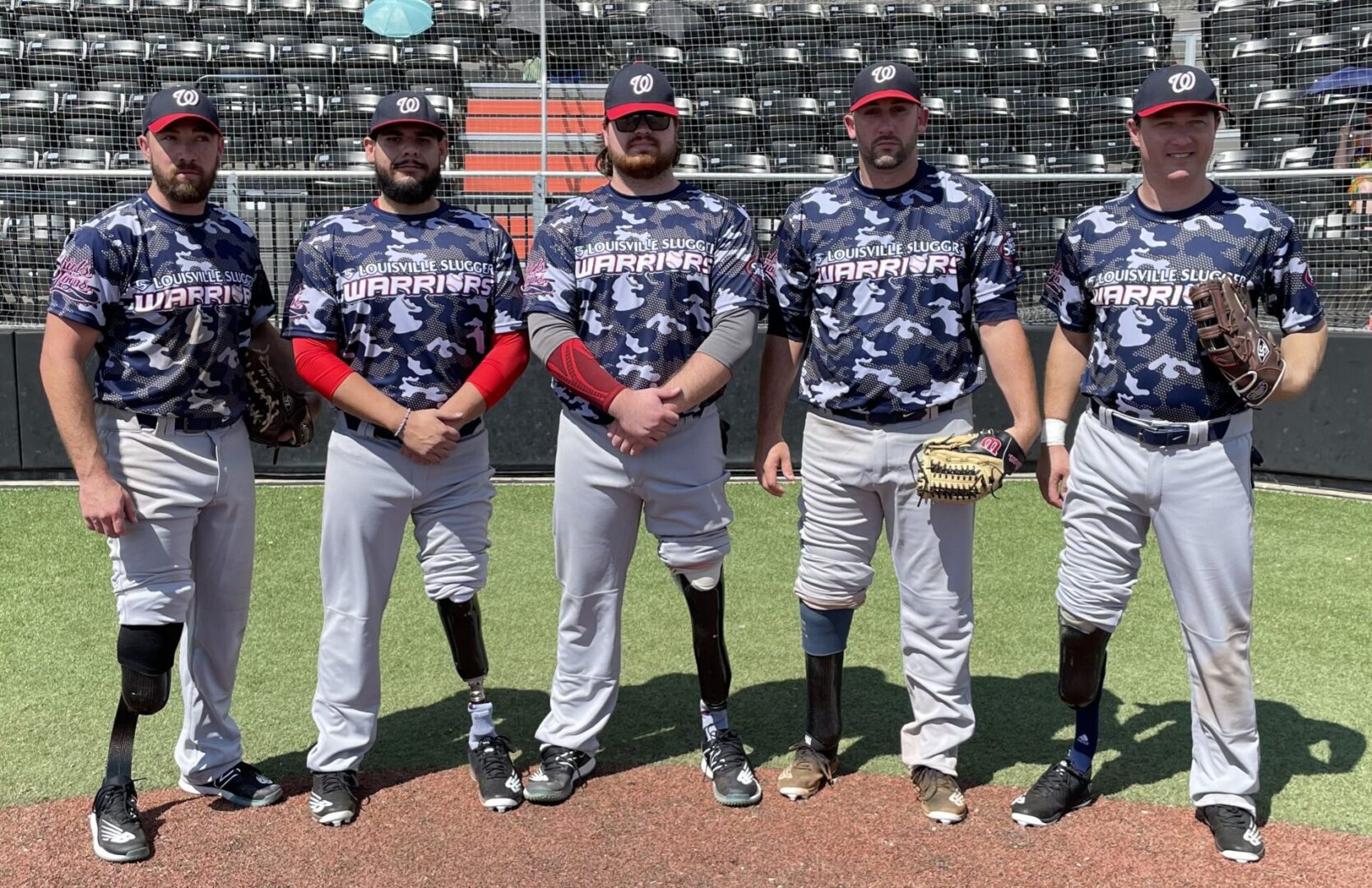 A group of baseball players standing on top of a field.