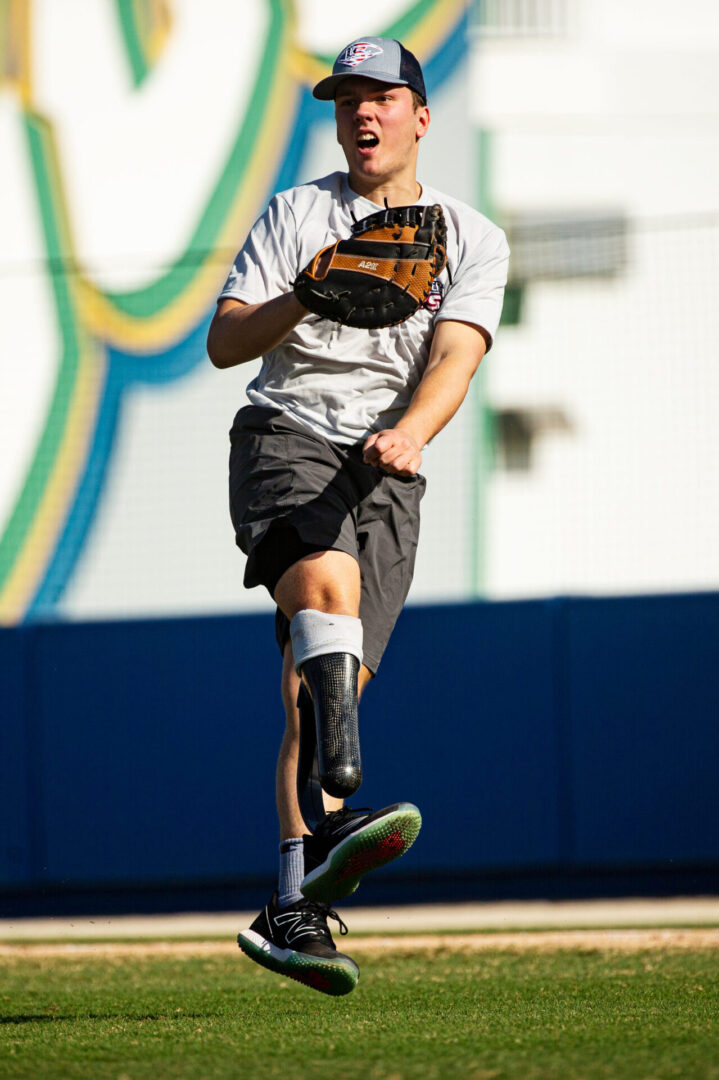 Syndication: The News-Press Michael Came throws the ball to a teammate on the The Louisville Slugger Warriors Amputee Baseball Team on Friday, Jan. 5, 2024. The team was in town to film their national documentary ÒCurveballsÉ Secrets to the Game of LifeÓ at Swanson Stadium at FGCU.